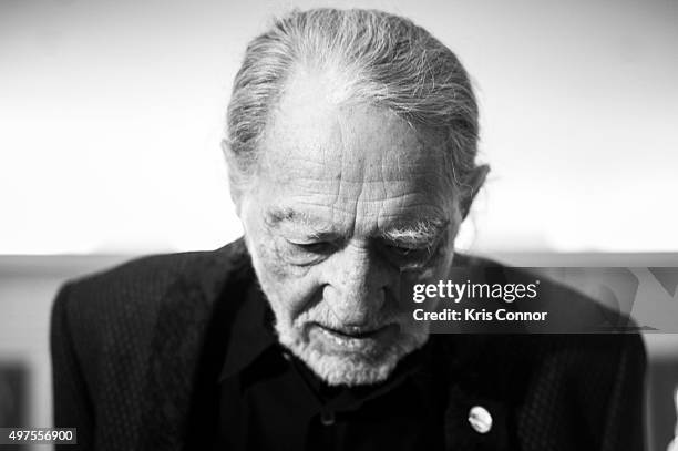 Willie Nelson check out artifacts after attending the 2015 Gershwin Prize Luncheon where he was honored with a certificate and an American flag in...