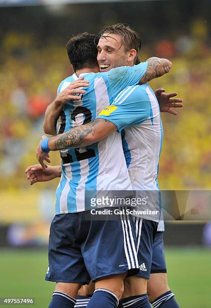 Lucas Biglia of Argentina celebrates with teammate Ezequiel Lavezzi after scoring the opening goal during a match between Colombia and Argentina as...