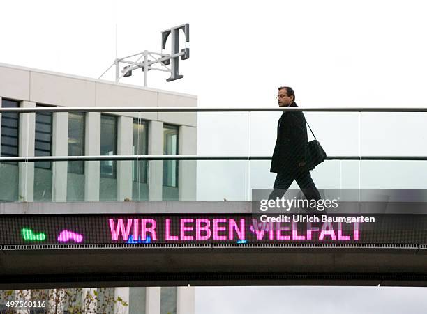 Bridge crossing between the buildings of the Telekom headquarters in Bonn with the neon sign WE LIVE DIVERSITY.