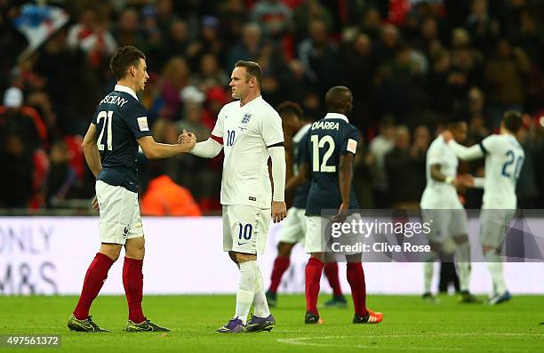 Wayne Rooney of England and Laurent Koscielny of France shake hands after the International Friendly match between England and France at Wembley...