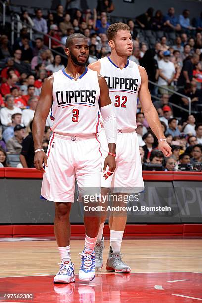 Chris Paul of the Los Angeles Clippers and Blake Griffin of the Los Angeles Clippers stand on the court against the Golden State Warriors at STAPLES...
