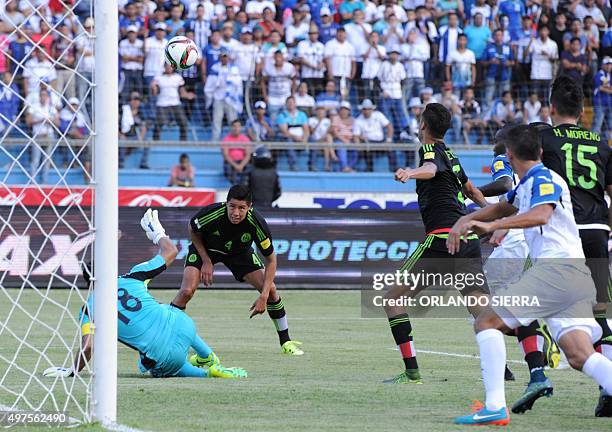 Mexico's Hugo Ayala eyes the ball next to Honduras' goalie Noel Valladares during the Russia 2018 FIFA World Cup Concacaf Qualifiers football match,...