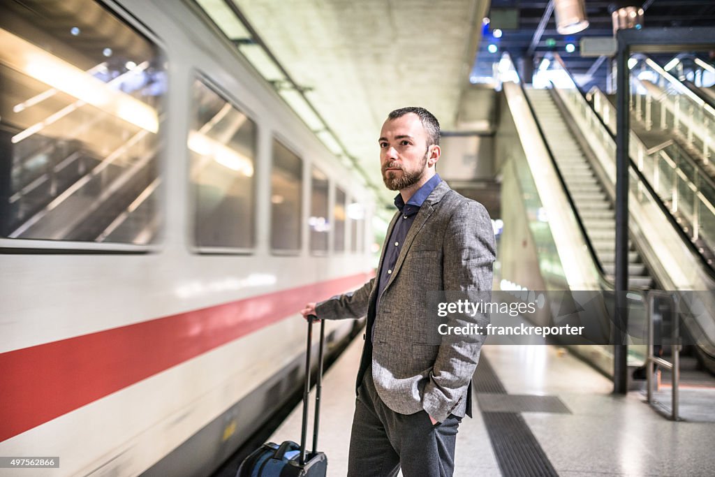 Businessman waiting the train platform at the station