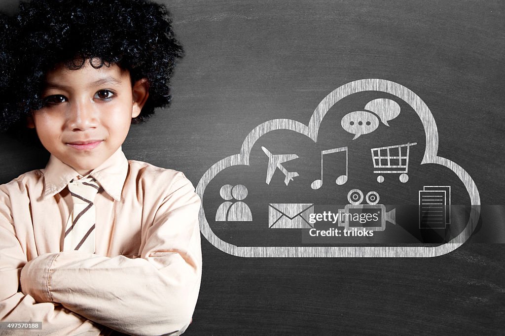 Schoolboy with cloud computing icon drawn on blackboard