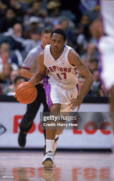 Percy Miller of the Toronto Raptors dribbles the ball during the game against the Cleveland Cavaliers at the Air Canada Centre in Toronto, Canada....