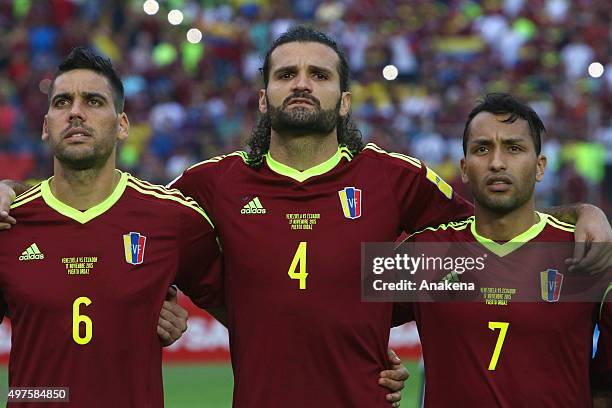 Gabriel Cichero Oswaldo Vizcarrondo and Jeffren Suarez of Venezuela sing during the anthem ceremony prior a match between Venezuela and Ecuador as...