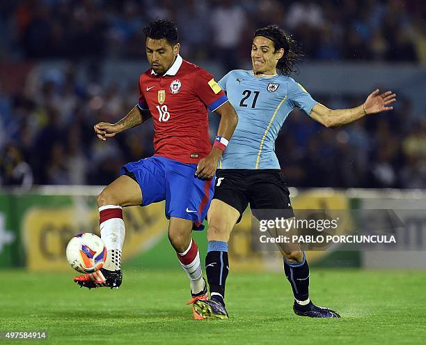Uruguay's Edinson Cavani markes Chile's Gonzalo Jara during their Russia 2018 FIFA World Cup South American Qualifiers football match, in Montevideo,...