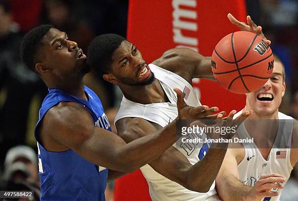 Amile Jefferson of the Duke Blue Devils grabs a rebound in front of Alex Poythress of the Kentucky Wildcats during the Champions Classic at the...