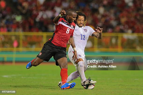 S Khaleem Hyland battles to win the ball from USA's Jermaine Jones during a World Cup Qualifier between Trinidad and Tobago and USA as part of the...