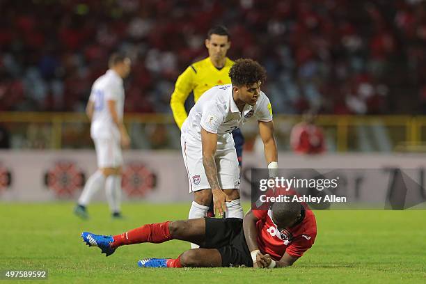 DeAndre Yedlin apologises to T&T's Khaleem Hyland during a World Cup Qualifier between Trinidad and Tobago and USA as part of the FIFA World Cup...