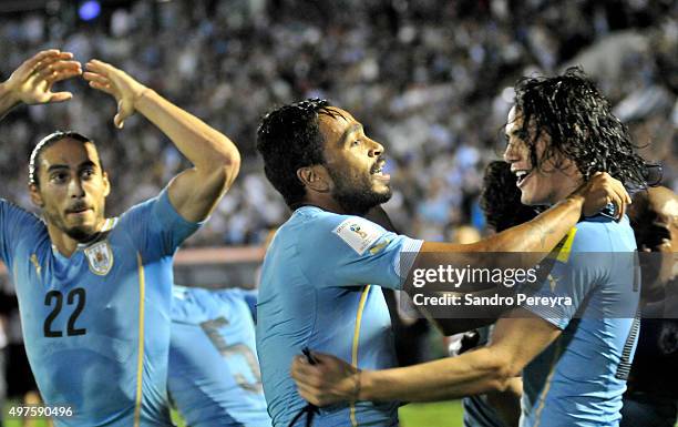 Alvaro Pereira of Uruguay celebrates with Edinson Cavani after scoring the second goal of his team during a match between Uruguay and Chile as part...