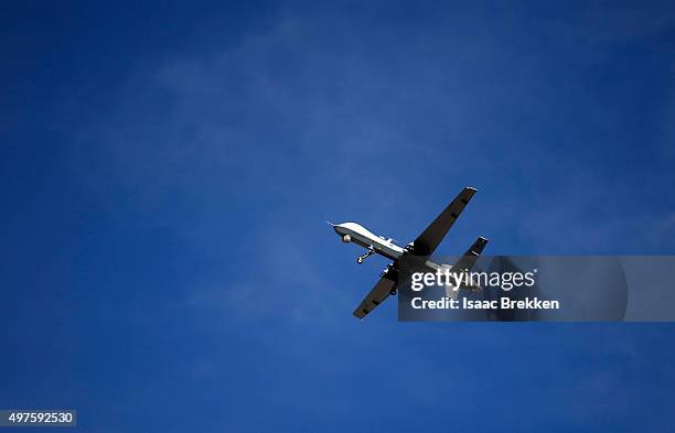An MQ-9 Reaper remotely piloted aircraft flies by during a training mission at Creech Air Force Base on November 17, 2015 in Indian Springs, Nevada....