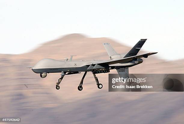 An MQ-9 Reaper remotely piloted aircraft flies by during a training mission at Creech Air Force Base on November 17, 2015 in Indian Springs, Nevada....
