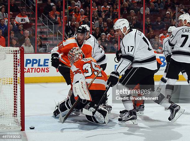 Milan Lucic of the Los Angeles Kings scores against Steve Mason of the Philadelphia Flyers at 19:04 of the third period to tie the score at 2-2 at...