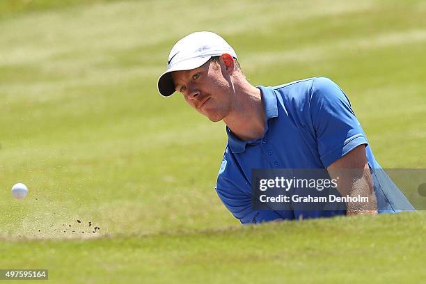 Richmond Tigers AFL player Jack Riewoldt plays a shot from the bunker during the Pro-Am ahead of the 2015 Australian Masters at Huntingdale Golf...