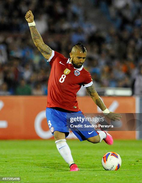 Arturo Vidal of Chile takes a shot during a match between Uruguay and Chile as part of FIFA 2018 World Cup Qualifiers at Centenario Stadium on...