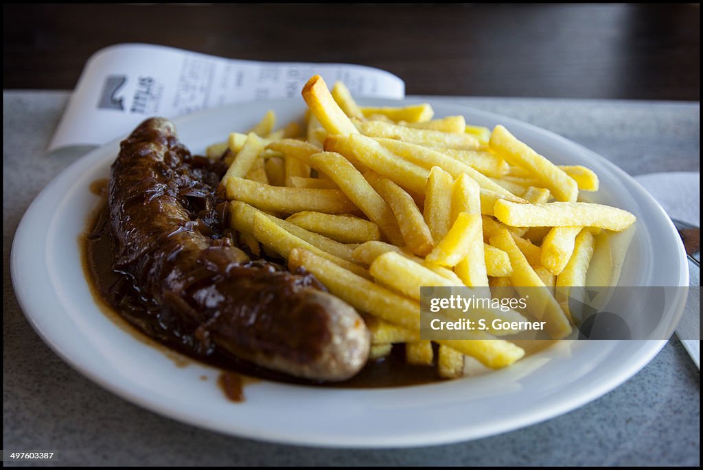 Sausage, onion sauce and french fries