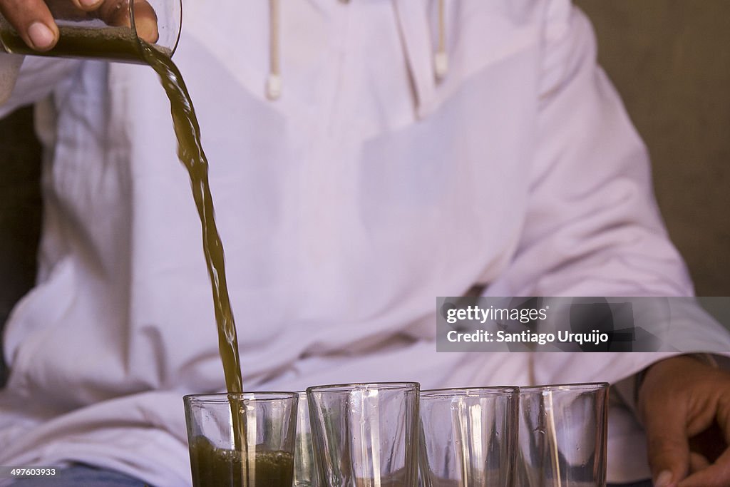 Berber man pouring tea in glasses