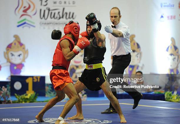Arnel Mandal of Philippines competes against Selahattin Yildiz of Turkey in the semi-final Men's 52kg Sanda Competition during the 2015 World Wushu...