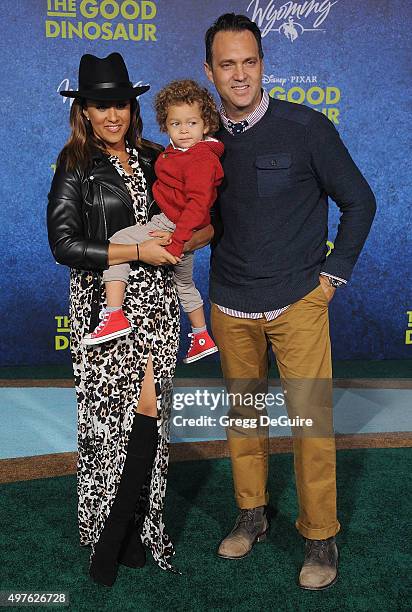 Actress Tamera Mowry-Housley, son Aden John Tanner Housley and husband Adam Housley arrive at the premiere of Disney-Pixar's "The Good Dinosaur" on...