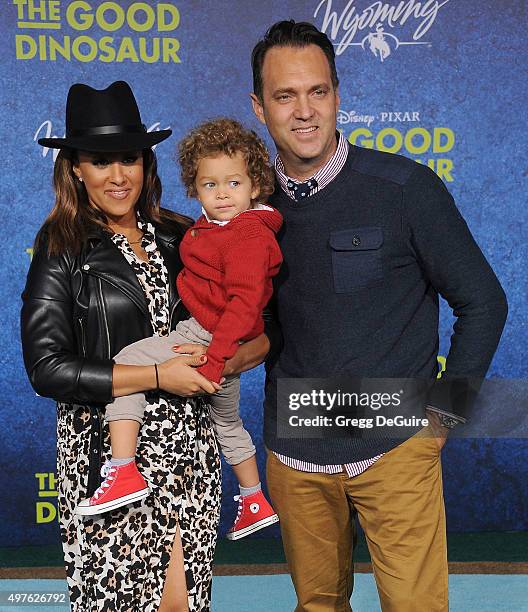 Actress Tamera Mowry-Housley, son Aden John Tanner Housley and husband Adam Housley arrive at the premiere of Disney-Pixar's "The Good Dinosaur" on...