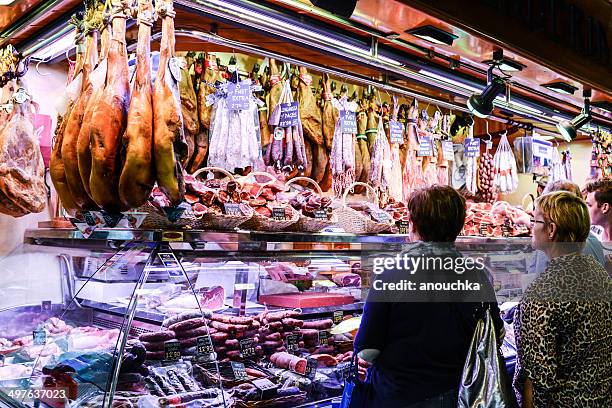 sausages and ham for sale, la boqueria market, barcelona - animal leg stock pictures, royalty-free photos & images