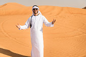 arabic man smiling on the desert