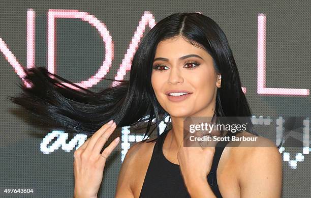 Kylie Jenner adjusts her hair as Kendall Jenner and Kylie Jenner arrive at Chadstone Shopping Centre on November 18, 2015 in Melbourne, Australia.