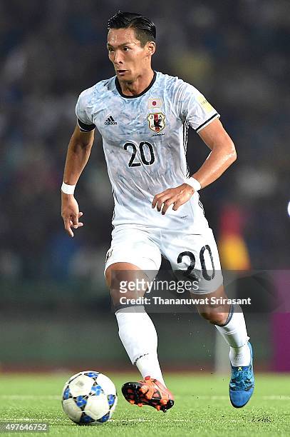 Tomoaki Makino of Japan runs with the ball during the 2018 FIFA World Cup Qualifier match between Cambodia and Japan on November 17, 2015 in Phnom...