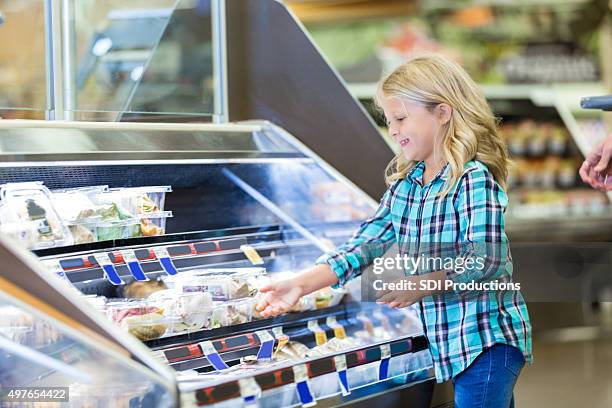 little girl shopping at deli counter with mom in supermarket - convenience food stock pictures, royalty-free photos & images