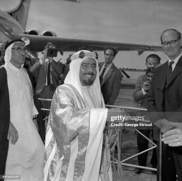 The Sheik of Bahrain arriving at London Airport, met by Lord Carrington, July 1964.