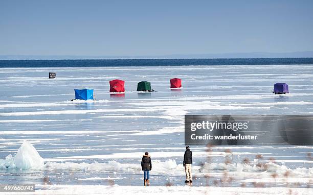 ice fishing huts on lake superior - duluth stock pictures, royalty-free photos & images
