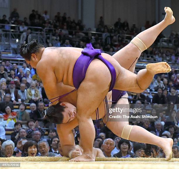 Shohozan throws Brazilian wrestler Kaisei to win during day eleven of the Grand Sumo Kyushu Tournament at Fukuoka Convention Center on November 18,...