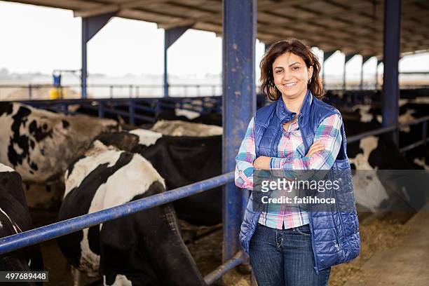 young woman farmer - female animal stock pictures, royalty-free photos & images