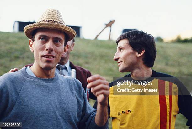 Middle distance runners Steve Ovett and Sebastian Coe share a joke circa 1984.