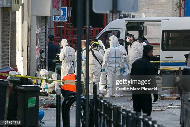 French Police Forensics officers work on Rue des Corbillon in the northern Paris suburb of Saint-Denis following a raid on an apartment on November...