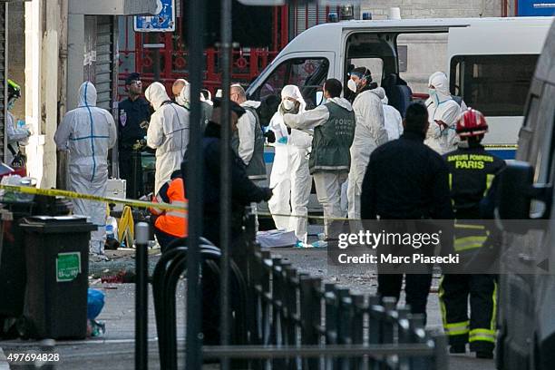 French Police Forensics officers work on Rue des Corbillon in the northern Paris suburb of Saint-Denis following a raid on an apartment on November...