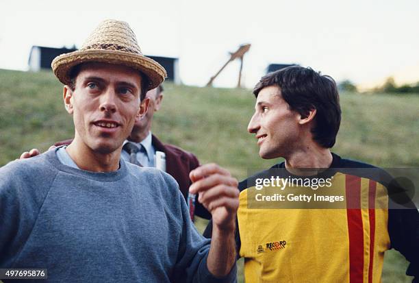 Middle distance runners Steve Ovett and Sebastian Coe share a joke circa 1984.