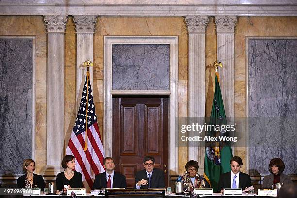 Secretary of the Treasury Jacob Lew speaks as Assistant Director of Office of Financial Education of Consumer Financial Protection Bureau Janneke...