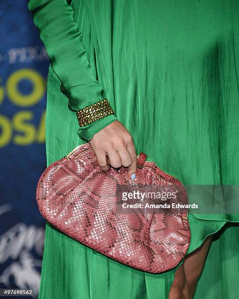 Actress Alyshia Ochse, clutch detail, arrives at the premiere of Disney-Pixar's "The Good Dinosaur" on November 17, 2015 in Hollywood, California.