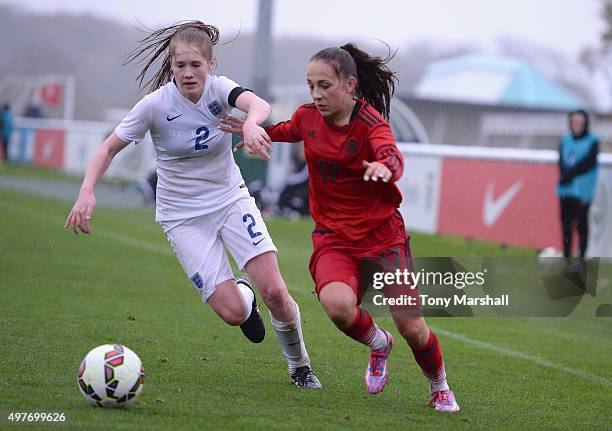 Amy Rodgers of England tackles Gina Chmielinski of Germany during Women's U16s International Friendly match between England U16s Women and Germany...