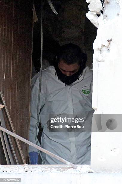 Police Forensic officer works in the damaged building that was raided earlier in the morning is pictured on November 18, 2015 in Saint-Denis, France....