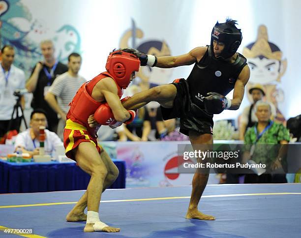 Uchit Sharma of India competes against Arnel Mandal of Philippines in the final match Men's 52kg Sanda Competition during the 2015 World Wushu...