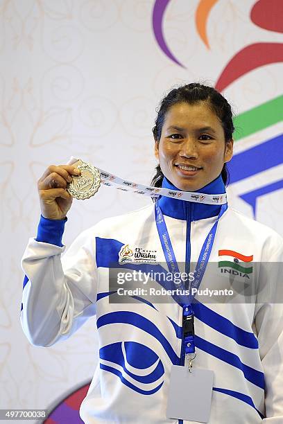 Sanathoi Devi Yumnam of India celebrates with her silver medal on the podium during the Women's 52kg Sanda Competition medals ceremony of the 2015...