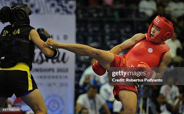 Luan Zhang of China competes against Sanathoi Devi Yumnam of India in the final match Women's 52kg Sanda Competition during the 2015 World Wushu...