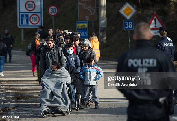 Refugees cross the border between Austria and Germany, on November 18, 2015 near Wegscheid, Germany.