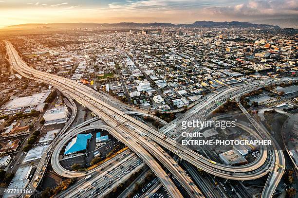 freeway interchanges at dusk - city of los angeles stockfoto's en -beelden