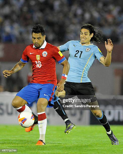 Gonzalo Jara of Chile and Edinson Cavani of Uruguay fight for the ball during a match between Uruguay and Chile as part of FIFA 2018 World Cup...