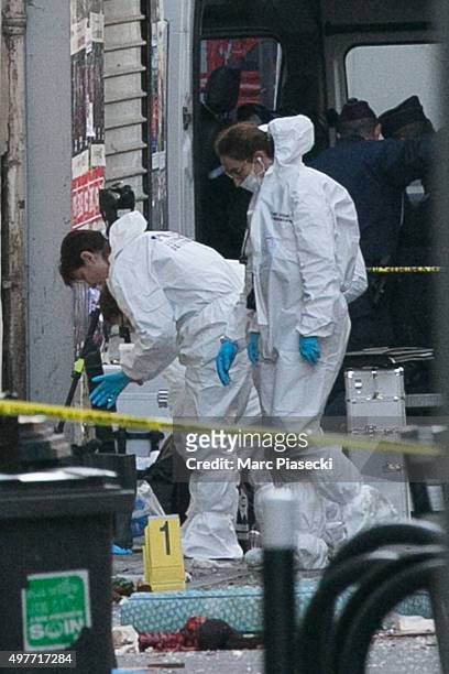 Forensics of the french police are seen in front of the '8, Rue du Corbillon' on November 18, 2015 in Saint-Denis, France. French Police special...