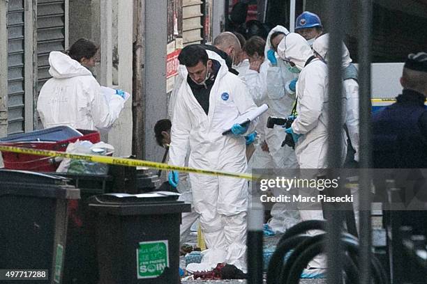 Forensics of the french police are seen in front of the '8, Rue du Corbillon' on November 18, 2015 in Saint-Denis, France. French Police special...